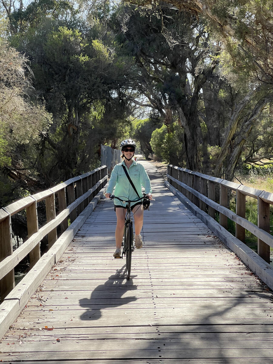 Woman riding over bridge on the Busselton Bike Loop